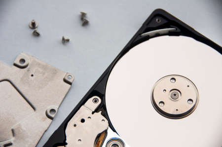 The abstract image of inside of hard disk drive on white cover background. Concept of data, hardware, and information technology. Copy spaceの写真素材