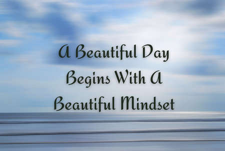 Inspirational quote - A beautiful day begins with a beautiful mindset. With blurry beach background in digital motion effect and bright smooth backdrop. Motivational conceptの写真素材