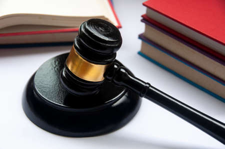 Lawyer gavel on white cover with books background. Law conceptの写真素材