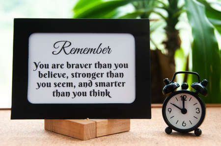 Motivational quote text on notepad - You are braver than you believe, stronger than you seem, and smarter than you think. Motivational conceptの写真素材