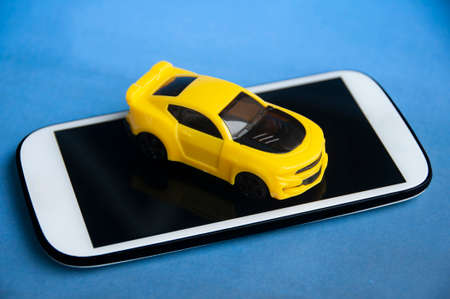 Car on top of smart phone. Conceptualの写真素材