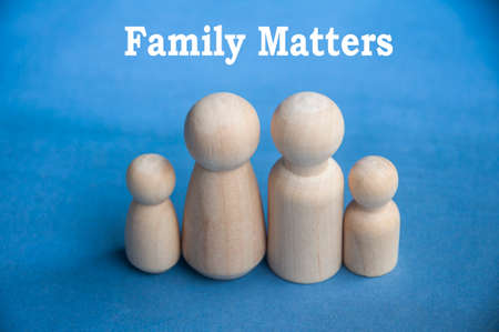 Family matter text with family wooden dolls. Family conceptの写真素材