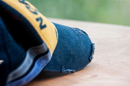 Image of a hat on wooden table. Copy spaceの写真素材