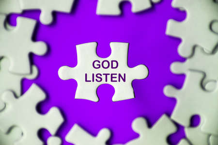 God listen text on missing jigsaw puzzle with purple color background. Religious conceptの写真素材