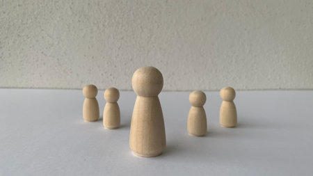 Model wooden doll representing leadership. Leadership concept
