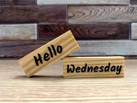 Text on wooden blocks - Hello Wednesday. Greetings conceptの写真素材