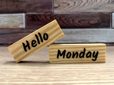Text on wooden blocks - Hello Monday. Greetings conceptの写真素材