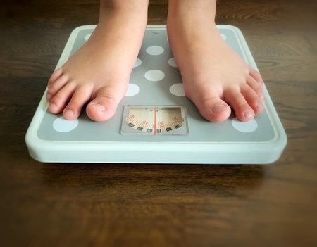 Close up of weight scale with blur surrounding background. Fitness and weight loss conceptの写真素材