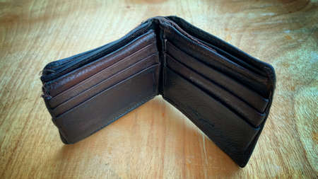Old wallet on the wooden table. Conceptualの写真素材