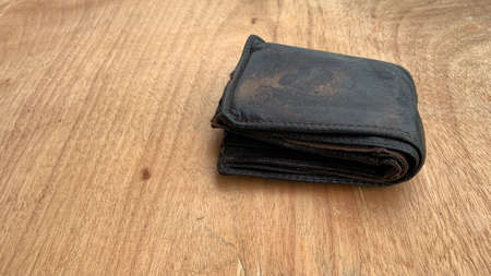 Old wallet on the wooden table. Conceptualの写真素材