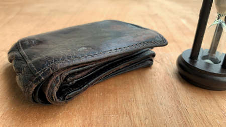 Old wallet on the wooden table. Conceptualの写真素材
