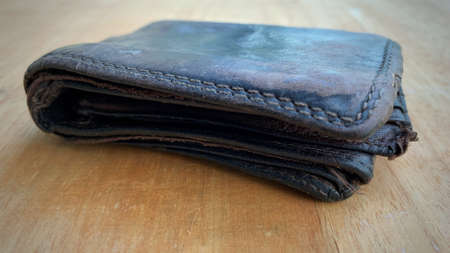 Old wallet on the wooden table. Conceptualの写真素材