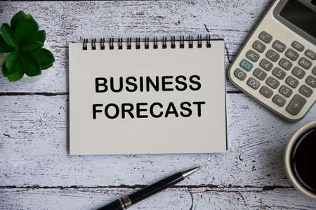Cash flow projection text on notepad with calculator, pen and glasses background. Business and cash flow conceptの写真素材