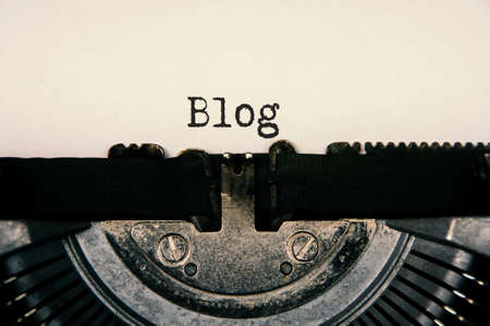 Blog text on an old vintage typewriter. Blogging conceptの写真素材