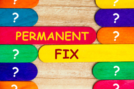 Permanent fix text on colorful wooden stick - Problem solving concept.の写真素材