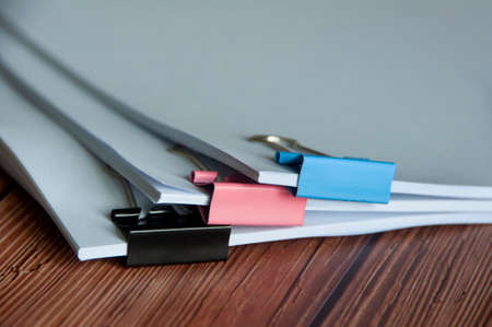Paper stack of pile of documents on wooden desk. Copy space and business offices conceptの写真素材