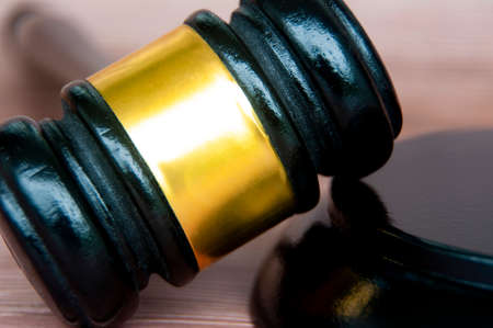 Close up of gavel with wooden background. Copy space and law concept