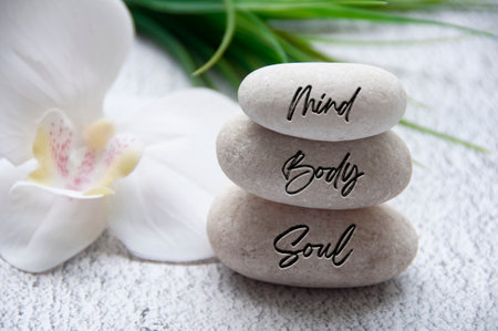 Mind, Body and Soul words engraved on zen stones with space for text. Health life conceptの写真素材