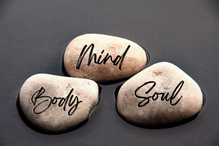 Mind, Body and Soul words engraved on stones. Healthy life concept.の写真素材