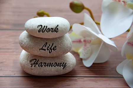 Work life harmony text engraved on stones. New ways of working culture. Conceptual.の写真素材