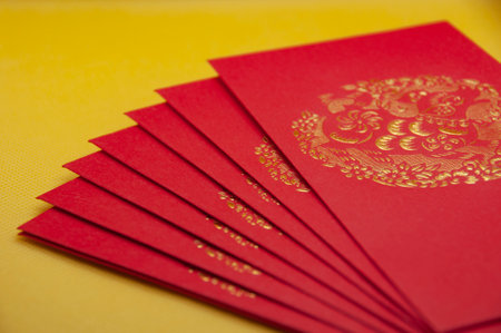 Chinese New Year packets on yellow background.