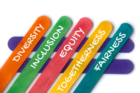 Diversity, inclusion, equality, togetherness and fairness text on colorful wooden stick - Business...