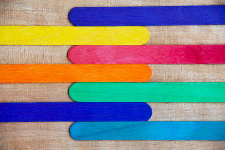 Top view of colored wooden sticks with customizable space for text. Copy space.の写真素材