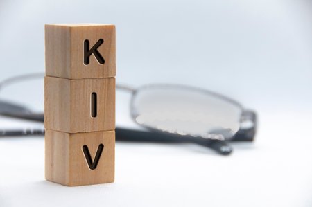 KIV text engraved on wooden blocks with white cover background. Keep in view concept. Copy spaceの写真素材