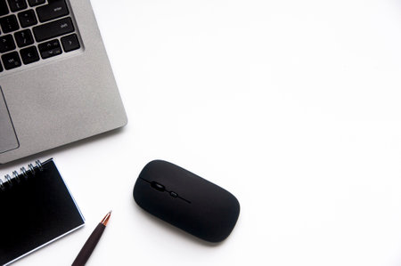 Top view of laptop, notepad and mouse on white cover background with customizable space for text. Copy space.の写真素材