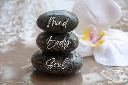 Mind, Body and soul text engraved on black zen stones. Zen concept.の写真素材