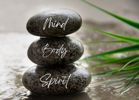 Mind, Body and spirit words engraved on zen stones. Zen concept.の写真素材