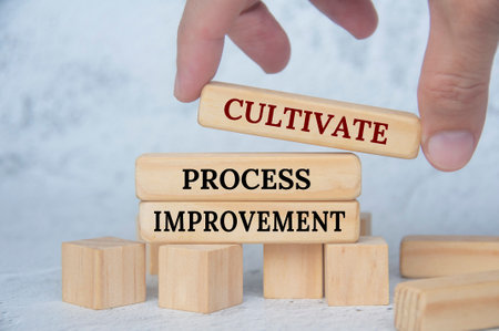 Cultivate process improvement on wooden blocks. Continuous improvement concept.の写真素材