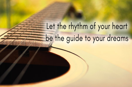 Motivational and inspirational quote - Let the rhythm of your heart be the guide to your dreams.. With Guitar backgroundの写真素材