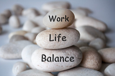 Work life balance text engraved on white zen stones. Work, lifestyle and life balance conceptの写真素材