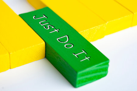 Just do it text on green wooden block. Motivational concept.の写真素材