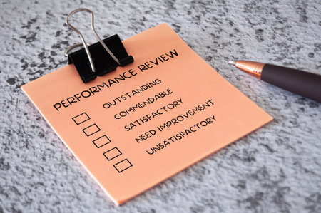 Performance Review checklist on sticky notes. Performance review conceptの写真素材