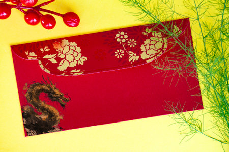 Top view of Chinese New Year red packet with golden dragon. Chinese New Year celebrations.