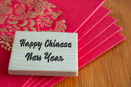 Happy Chinese New Year wishes with red packets envelopeの写真素材