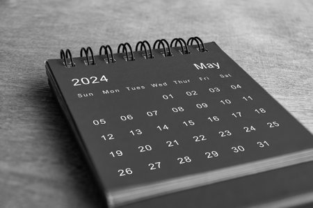 Black and white May 2024 desk calendar on wooden desk. New month conceptの写真素材
