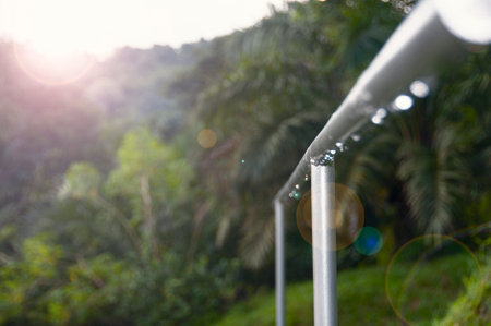 Close up view of stainless steel staircase hand with wonderful nature view.