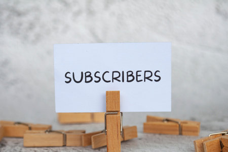 Subscribers text on standing yellow paper. Lead generation concept.の写真素材