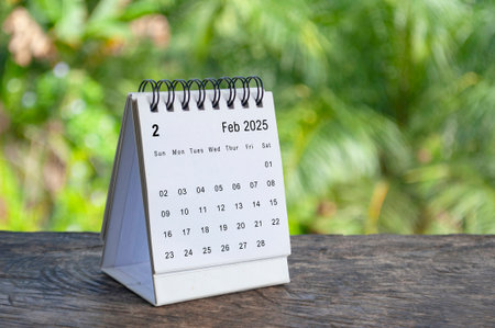 February 2025 white table calendar with outdoor background. Calendar concept.の写真素材
