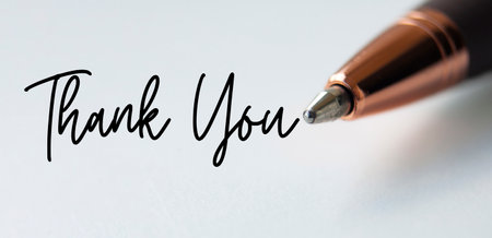 Thank you text on white background with close up of penの写真素材