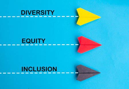 Top view of multicolored paper airplane with text, Diversity, Equity and Inclusion. DE and I...