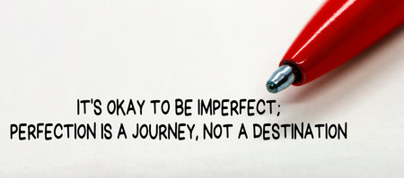 It okay to be imperfect, perfection is a journey, not a destination text with close up blue red background.の写真素材
