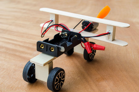 Back view of Do It Yourself toy airplane made by wooden sticks and DC motor. DIY conceptの写真素材
