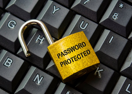 Top view of password protected text engraved on padlock with keyboard background. Password security concept.の写真素材