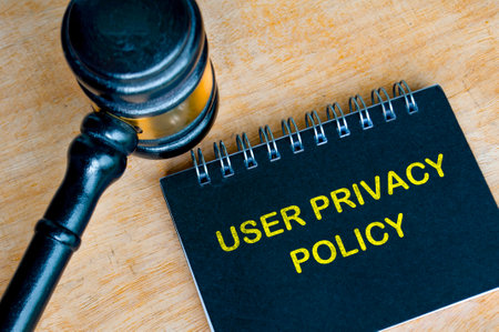 Top view of User Privacy policy text with gavel and pen background. User Privacy concept.