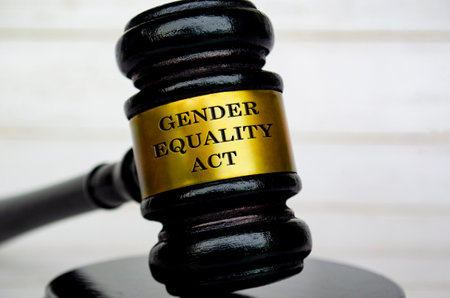 Gender Equality Act text engraved on gavel. Protection of gender equality concept.