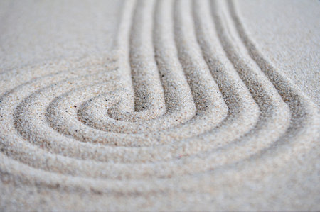 lines and circle formation on beach sand with customizable space for text.